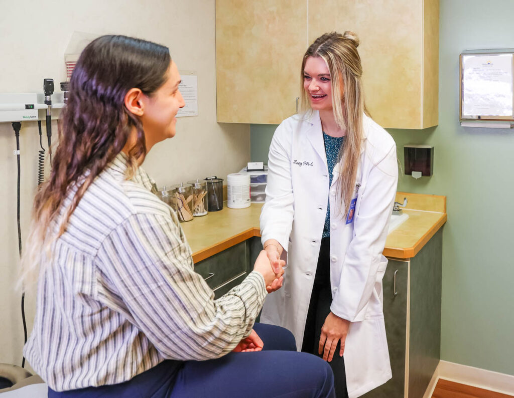Zoey Keene talking to a patient